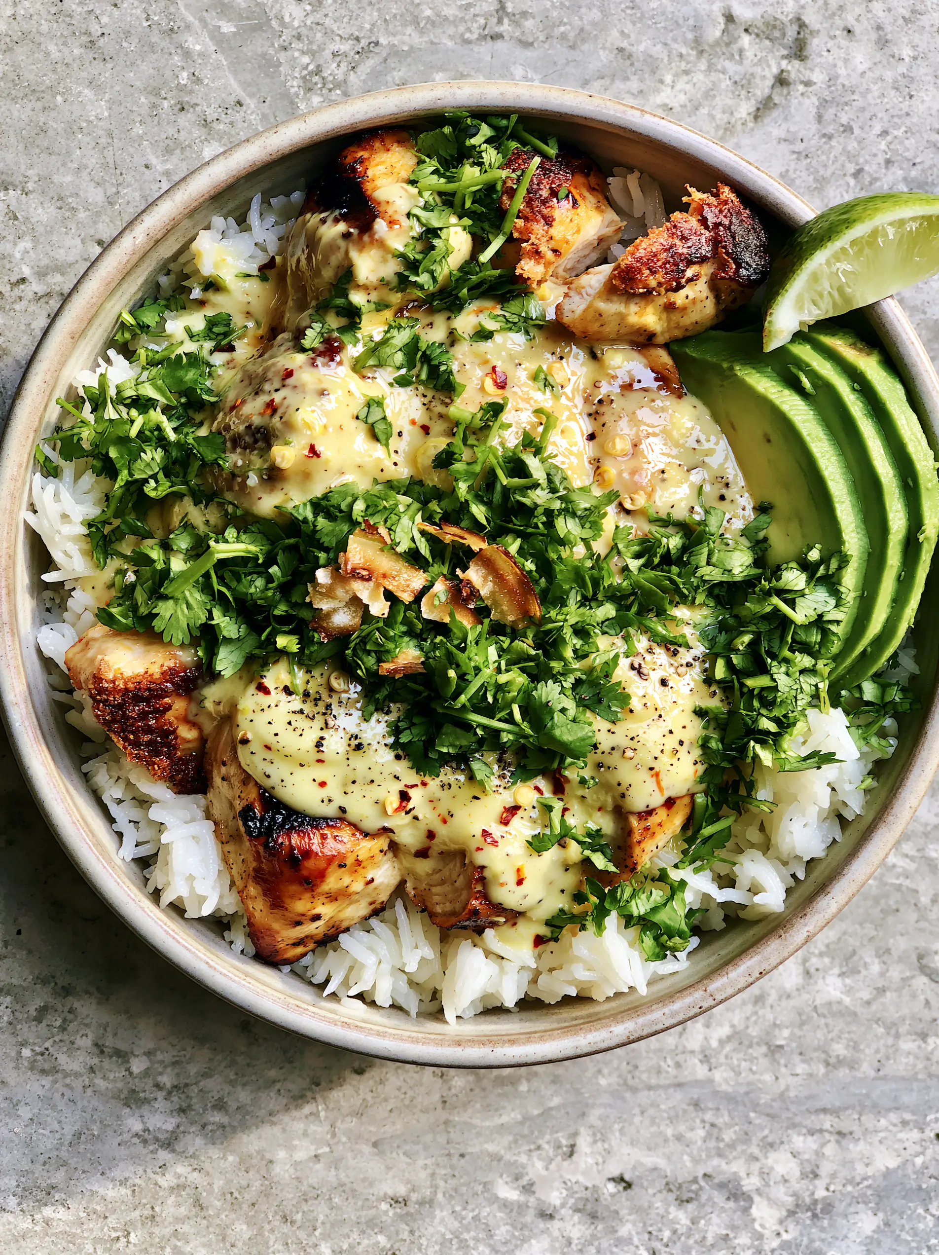 Coconut Chicken Rice Bowl: The Ultimate Creamy 30-Minute Tropical Dinner 3 Overhead shot of a Coconut Chicken Rice Bowl with charred chicken breast and creamy pale-yellow sauce.