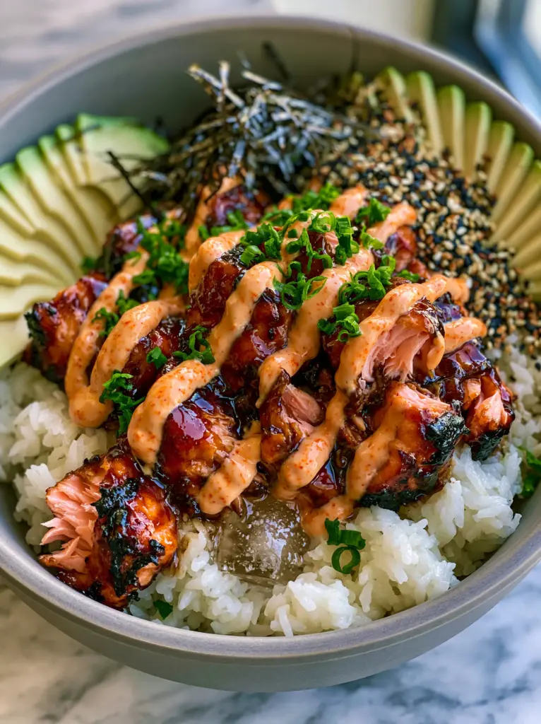 Salmon Rice Bowls with Honey-Soy Glaze and Creamy Spicy Mayo 1 Detailed shot of salmon rice bowls highlighting the creamy spicy mayo drizzle and toasted sesame seeds.