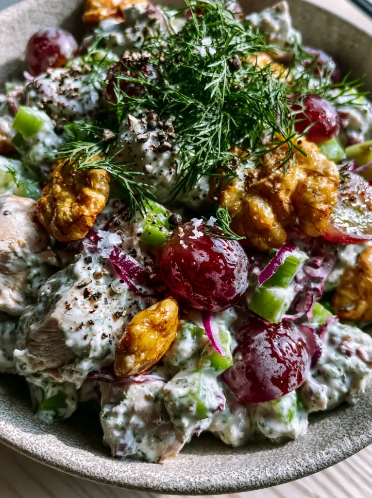 Homemade Chicken Salad with Velvety Greek Yogurt and Toasted Walnuts 2 Close-up of Homemade Chicken Salad showing velvety dressing, red grapes, and fresh dill.