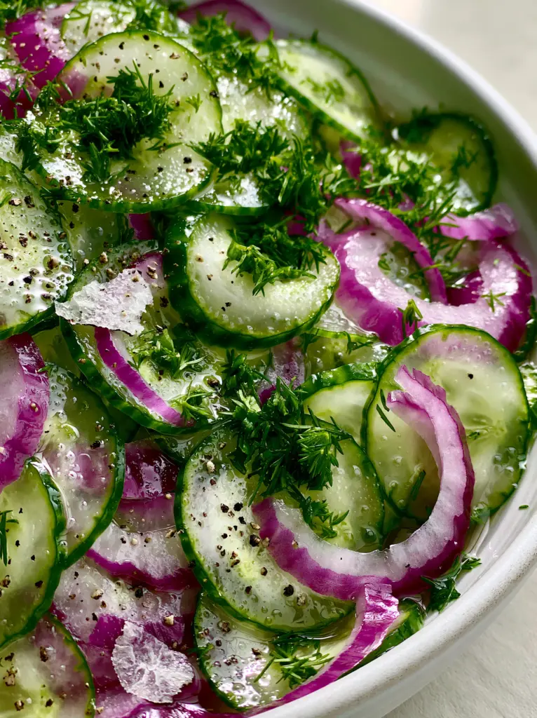 Vinegar Cucumber Salad: The Ultimate Crisp and Tangy Summer Side Dish 2 Extreme close-up of translucent English cucumber slices and purple red onion slivers. (vinegar cucumber salad)