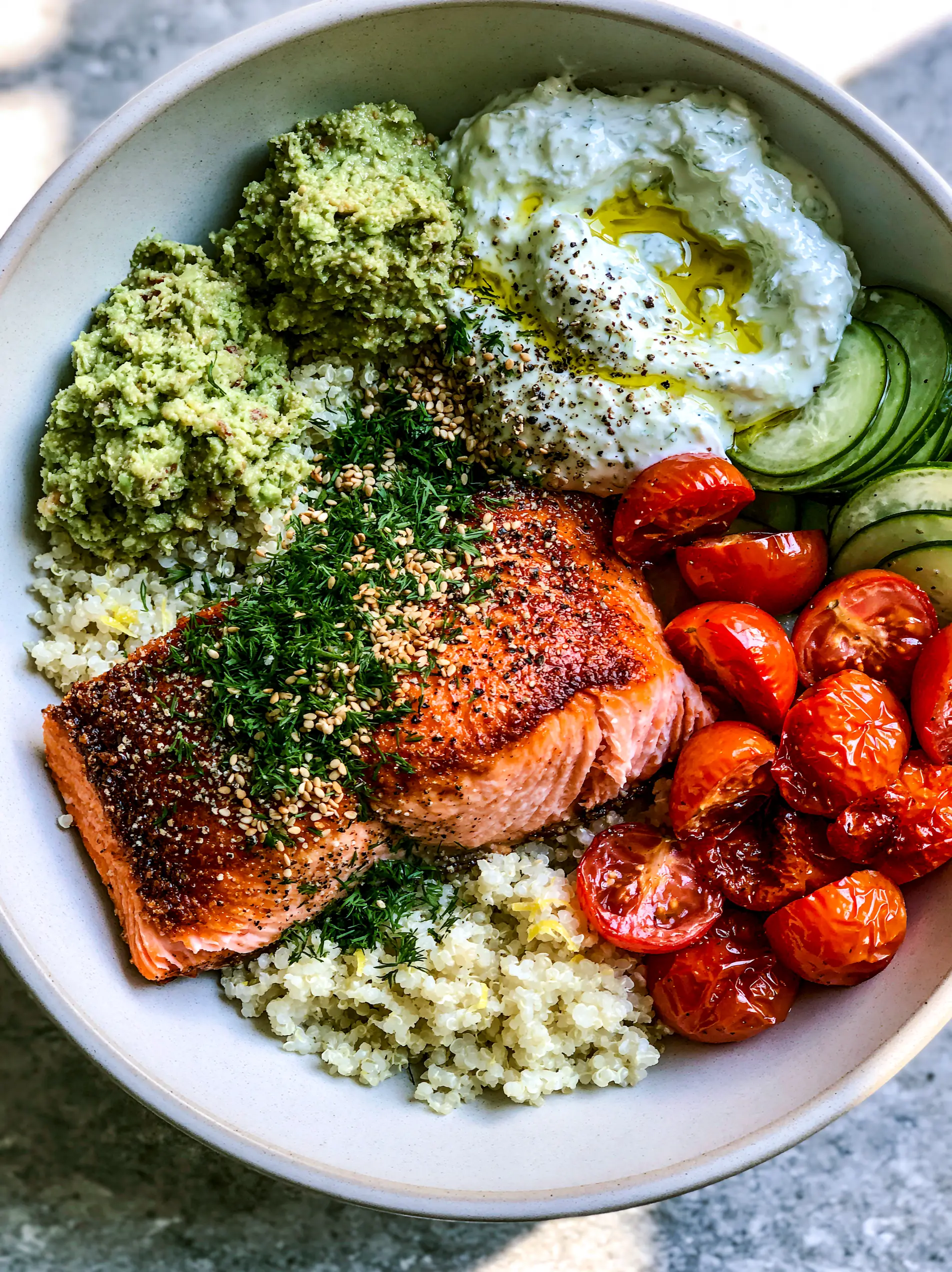 Light dinner ideas: Mediterranean Salmon Quinoa Power Bowl 4 Close-up of a pan-seared salmon fillet with crispy golden edges and moist pink flakes. (Light dinner ideas)