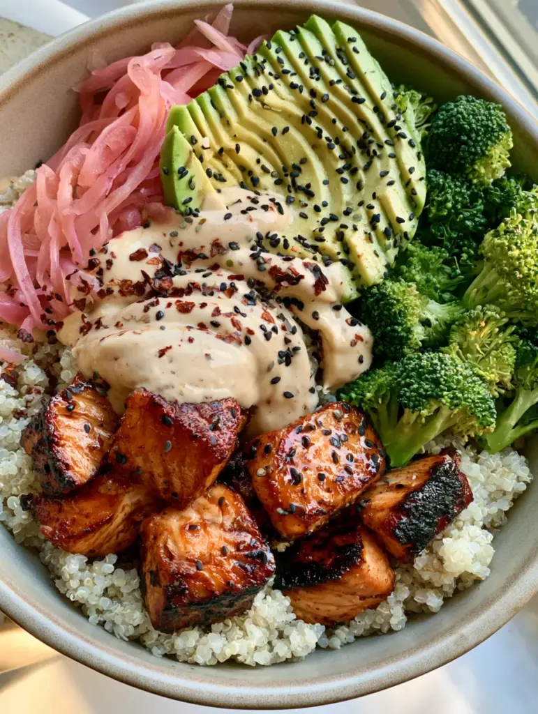 Healthy Foods: The Ultimate Honey-Glazed Salmon and Quinoa Bowl 1 Creamy lemon-tahini sauce drizzled over a bed of quinoa and honey-glazed salmon. (Healthy Foods)